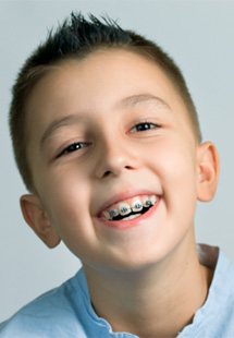 a child wearing braces near Keene