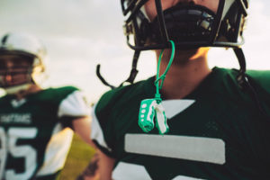 Kids playing football with mouthguards 