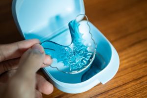 Closeup of a blue retainer from your Cleburne orthodontist