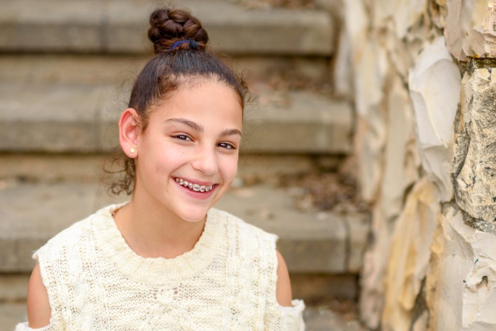 Closeup of child with braces smiling