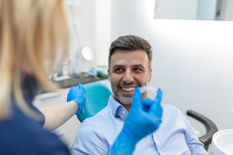 patient talking to an orthodontist